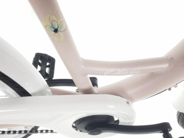 Detaljbild av rosa cykel med blomma.