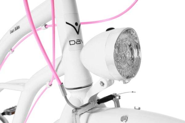 Biały rower z różowym oświetleniem