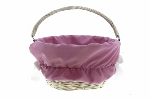 Vit korg med rosa tygöverdrag.