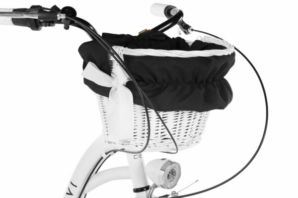 Vit cykelkorg med svart tygöverdrag och rosett
