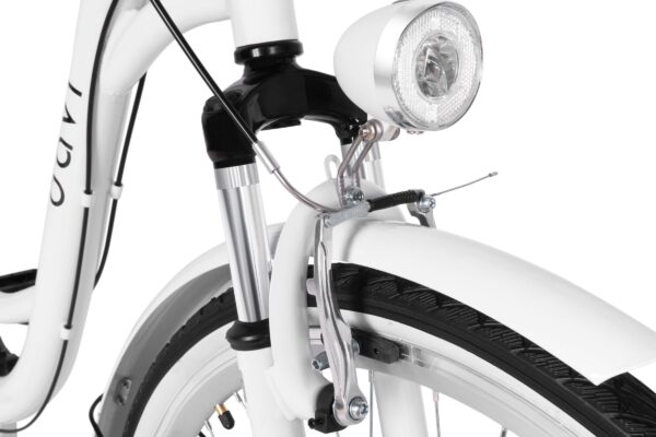 Detale białego roweru z lampą i hamulcem