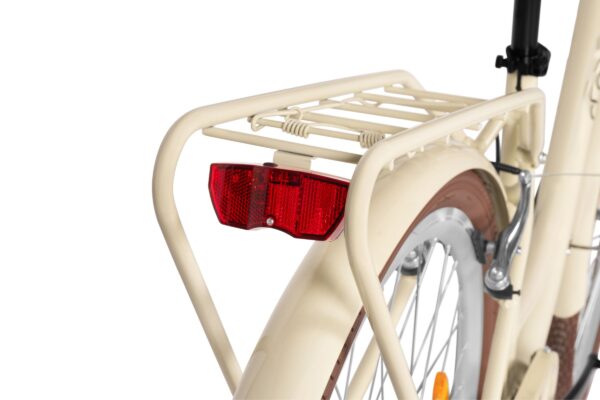 Tylny światło rowerowe na białym bagażniku