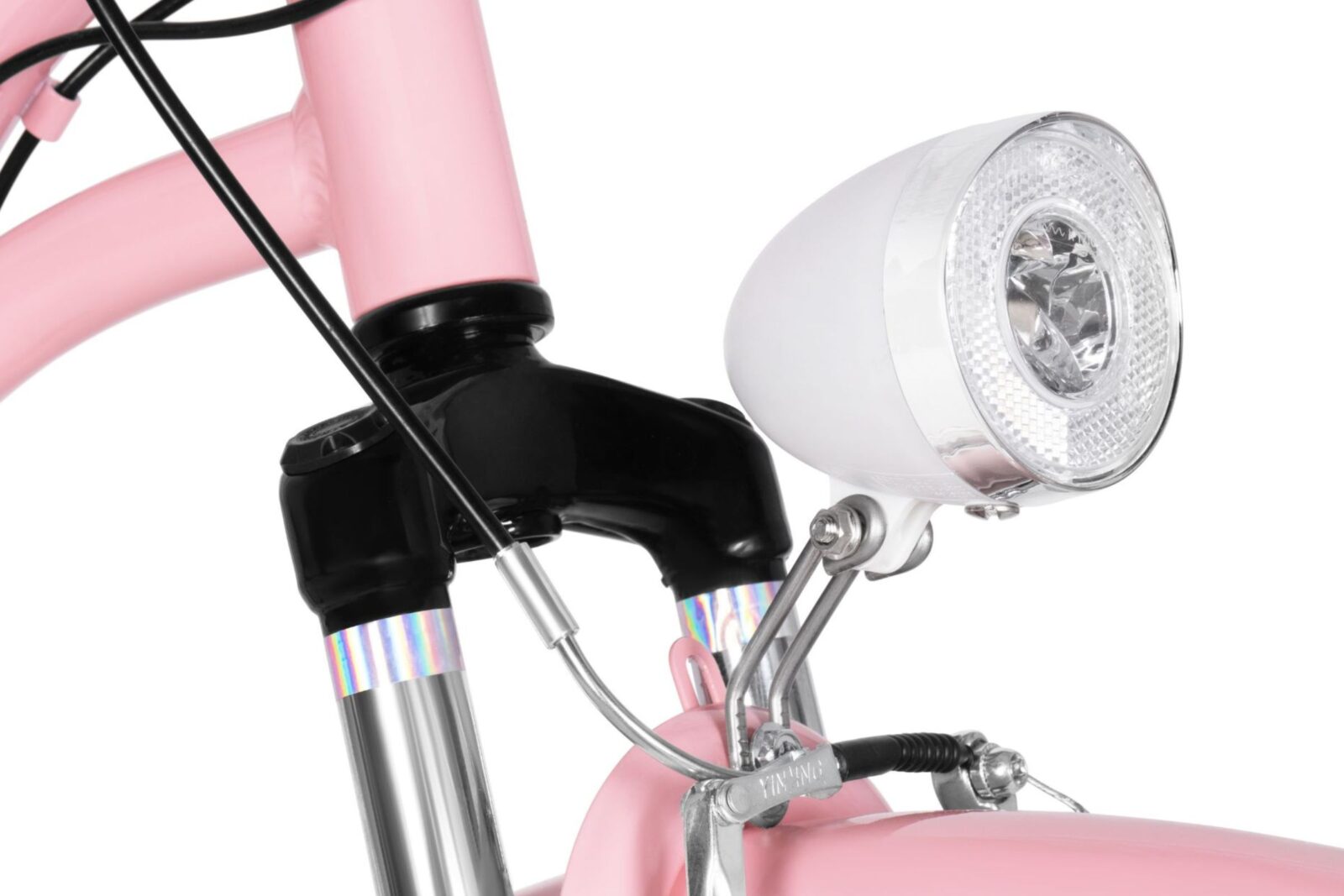 Różowy rower z lampą przednią.