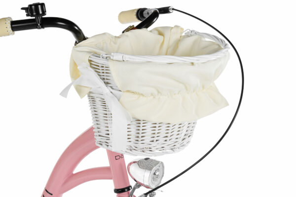 Vit cykelkorg med ljus tyginsats på rosa cykel.